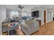 Spacious living room with hardwood floors and large windows that offer ample natural light at 200 Ne Renaissance Ne Pkwy # 304, Atlanta, GA 30308