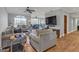 Bright living room featuring an open layout and hardwood floors for a modern feel at 200 Ne Renaissance Ne Pkwy # 304, Atlanta, GA 30308
