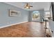 Living Room with tile floors, ceiling fan, and a large window that provides ample natural light at 200 Renaissance Ne Pkwy # 304, Atlanta, GA 30308