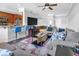 Open-concept living room and kitchen area with modern furnishings and a large TV at 200 Renaissance Ne Pkwy # 304, Atlanta, GA 30308