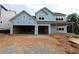 New construction showing a two-story home with an attached two-car garage at 214 Wild Ginger Bnd, Woodstock, GA 30188