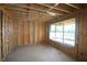 Framed interior featuring a large window with the sliding glass doors leading to the backyard at 214 Wild Ginger Bnd, Woodstock, GA 30188