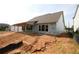 View of a new home under construction, featuring a covered patio and large windows at 214 Wild Ginger Bnd, Woodstock, GA 30188