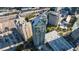 An aerial view of a modern building in a bustling city, showcasing contemporary architecture and an urban environment at 3338 Peachtree Ne Rd # 3406, Atlanta, GA 30326
