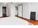 Bedroom with hardwood floors, with views into hallways, bathroom, and other bedrooms at 3338 Peachtree Ne Rd # 3406, Atlanta, GA 30326