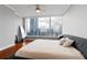 Bedroom with hardwood floors, ceiling fan, large windows, and stunning city views at 3338 Peachtree Ne Rd # 3406, Atlanta, GA 30326