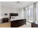 Bedroom featuring dark wood bed frame, city views, and a sliding door to the outside at 3338 Peachtree Ne Rd # 3406, Atlanta, GA 30326