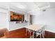Bright dining area with modern table and hardwood floors, open to the kitchen at 3338 Peachtree Ne Rd # 3406, Atlanta, GA 30326