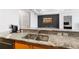 Kitchen sink featuring stainless steel sink, granite countertops and view to dining and main bedroom at 3338 Peachtree Ne Rd # 3406, Atlanta, GA 30326