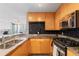 Bright kitchen with light wood cabinets, stainless steel appliances, and cityscape views at 3338 Peachtree Ne Rd # 3406, Atlanta, GA 30326