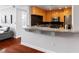 Open kitchen bar area with granite counters, hardwood floors, stainless appliances and breakfast bar at 3338 Peachtree Ne Rd # 3406, Atlanta, GA 30326