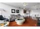Open living room with hardwood floors, comfortable seating, and a modern kitchen nearby at 3338 Peachtree Ne Rd # 3406, Atlanta, GA 30326