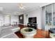 Bright living room features hardwood floors, modern decor, and sliding glass doors to balcony at 3338 Peachtree Ne Rd # 3406, Atlanta, GA 30326