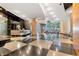 Beautiful lobby area with black and white checkered floor, featuring a reception desk and comfortable seating with lots of light at 3338 Peachtree Ne Rd # 3406, Atlanta, GA 30326