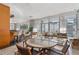 Bright lounge area featuring floor to ceiling windows with curtains, tables, chairs, and a bar with barstools at 3338 Peachtree Ne Rd # 3406, Atlanta, GA 30326
