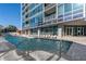 Outdoor pool with lounge chairs on the deck and an adjacent building with many windows at 3338 Peachtree Ne Rd # 3406, Atlanta, GA 30326