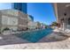 Outdoor pool with lounge chairs on the deck and an adjacent building with many windows at 3338 Peachtree Ne Rd # 3406, Atlanta, GA 30326
