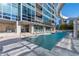 Outdoor pool with lounge chairs on the deck and an adjacent building with many windows at 3338 Peachtree Ne Rd # 3406, Atlanta, GA 30326