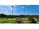View of multiple baseball fields under a bright sky with tall lighting fixtures for evening games at 3912 Edenton Ne Ct, Brookhaven, GA 30319