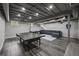 Finished basement with modern lighting, a ping pong table, and a comfortable lounge area at 3912 Edenton Ne Ct, Brookhaven, GA 30319