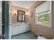 Well-lit bathroom with patterned tile floors, large vanity, and window with outside view at 3912 Edenton Ne Ct, Brookhaven, GA 30319