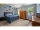 Charming bedroom featuring a full bed, a wardrobe, and hot air ballon wall decorations at 3912 Edenton Ne Ct, Brookhaven, GA 30319