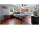 Light-filled bedroom with hardwood floors, ceiling fan, and bright decor in a welcoming home at 3912 Edenton Ne Ct, Brookhaven, GA 30319