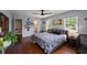 Bright bedroom with hardwood floors, light blue walls, and views of the outside from multiple windows at 3912 Edenton Ne Ct, Brookhaven, GA 30319