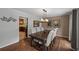 Elegant dining room featuring hardwood floors, modern light fixture, and neutral tones at 3912 Edenton Ne Ct, Brookhaven, GA 30319
