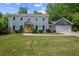 Charming two-story home with a large front yard and a basketball hoop on the garage at 3912 Edenton Ne Ct, Brookhaven, GA 30319