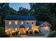 Charming two-story home with a landscaped front yard, inviting entrance, and attached garage at dusk at 3912 Edenton Ne Ct, Brookhaven, GA 30319