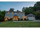 Beautiful two-story home with manicured lawn, mature trees, and an attached garage, offering curb appeal at 3912 Edenton Ne Ct, Brookhaven, GA 30319