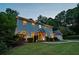 Charming two-story home with a well-manicured lawn and mature trees, creating a warm and inviting atmosphere at 3912 Edenton Ne Ct, Brookhaven, GA 30319