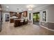 Updated kitchen features wooden cabinetry, stone countertops, a center island, and access to a covered porch at 3912 Edenton Ne Ct, Brookhaven, GA 30319