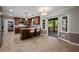 Updated kitchen features wooden cabinetry, stone countertops, a center island, and access to a covered porch at 3912 Edenton Ne Ct, Brookhaven, GA 30319