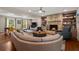 Inviting living room features a stone fireplace, built-in bookshelves, recessed lighting, and hardwood flooring at 3912 Edenton Ne Ct, Brookhaven, GA 30319