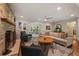 Inviting living room with a stone fireplace, hardwood floors and modern decor at 3912 Edenton Ne Ct, Brookhaven, GA 30319
