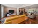 Inviting living room features a stone fireplace, built-in bookshelves, recessed lighting, and hardwood flooring at 3912 Edenton Ne Ct, Brookhaven, GA 30319