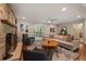 Inviting living room with a stone fireplace, hardwood floors and modern decor at 3912 Edenton Ne Ct, Brookhaven, GA 30319