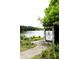 Sign at Murphey Candler Park entrance by a lake, showcasing lush greenery and a peaceful atmosphere at 3912 Edenton Ne Ct, Brookhaven, GA 30319