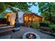 Outdoor patio with fire pit, seating, and grill, perfect for outdoor dining and entertaining at 3912 Edenton Ne Ct, Brookhaven, GA 30319