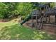 Well-maintained backyard with a playground including a slide and climbing frame at 3912 Edenton Ne Ct, Brookhaven, GA 30319