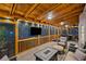 Relaxing screened porch with wood ceiling, comfortable seating, string lights, and mounted television at 3912 Edenton Ne Ct, Brookhaven, GA 30319