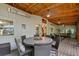 Large screened porch with ceiling heater featuring a dining table and seating area at 3912 Edenton Ne Ct, Brookhaven, GA 30319