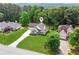 Aerial shot showcasing a well-maintained house with green lawns and tree coverage at 3935 Hamilton View Way, Dacula, GA 30019
