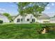 Expansive backyard with lush green lawn and mature trees, perfect for recreation and relaxation at 3935 Hamilton View Way, Dacula, GA 30019