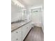 Bathroom featuring white vanity with granite countertop and tub/shower combo at 3935 Hamilton View Way, Dacula, GA 30019