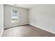 Neutral bedroom with large window offers lots of natural light and closet space at 3935 Hamilton View Way, Dacula, GA 30019