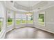 Bright dining room with tray ceiling, large windows, and stylish chandelier at 3935 Hamilton View Way, Dacula, GA 30019