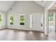 Bright entryway with light wood-look floors and multiple windows providing ample natural light at 3935 Hamilton View Way, Dacula, GA 30019